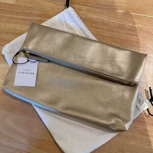 FAWN Design for the Jilly Box gold synthetic leather fold-over clutch